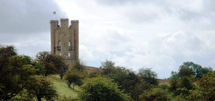 Broadway Tower stands over the surrounding green countryside.