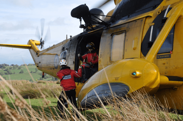 Helicopter lands in the wilderness with Mountain Rescue