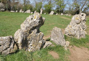 Great Rollright Stones by Embrace Historia. Gnarled, pitted rocks stand close together in the Rollright Stones stone circle.